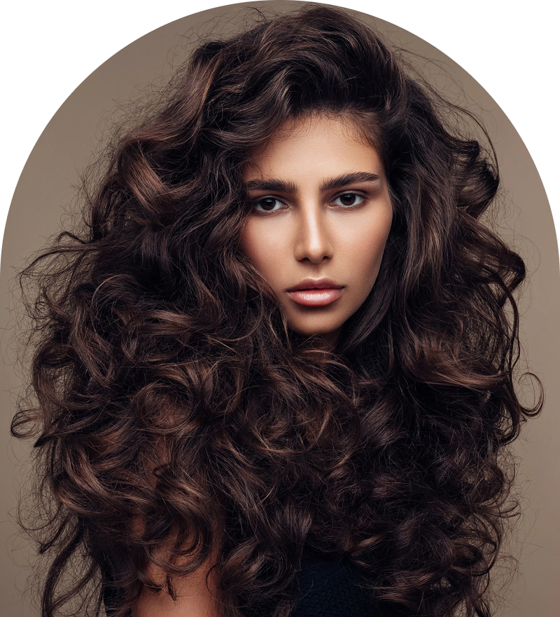 Woman with voluminous curly brown hair.