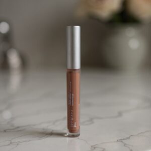 Liquid lipstick on a marble countertop.