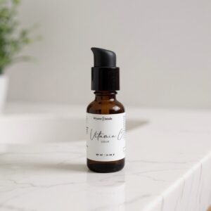 Vitamin C serum bottle on countertop.