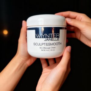 Hands holding a jar of skin cream.